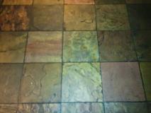 Before a completed grout cleaning service project in the area